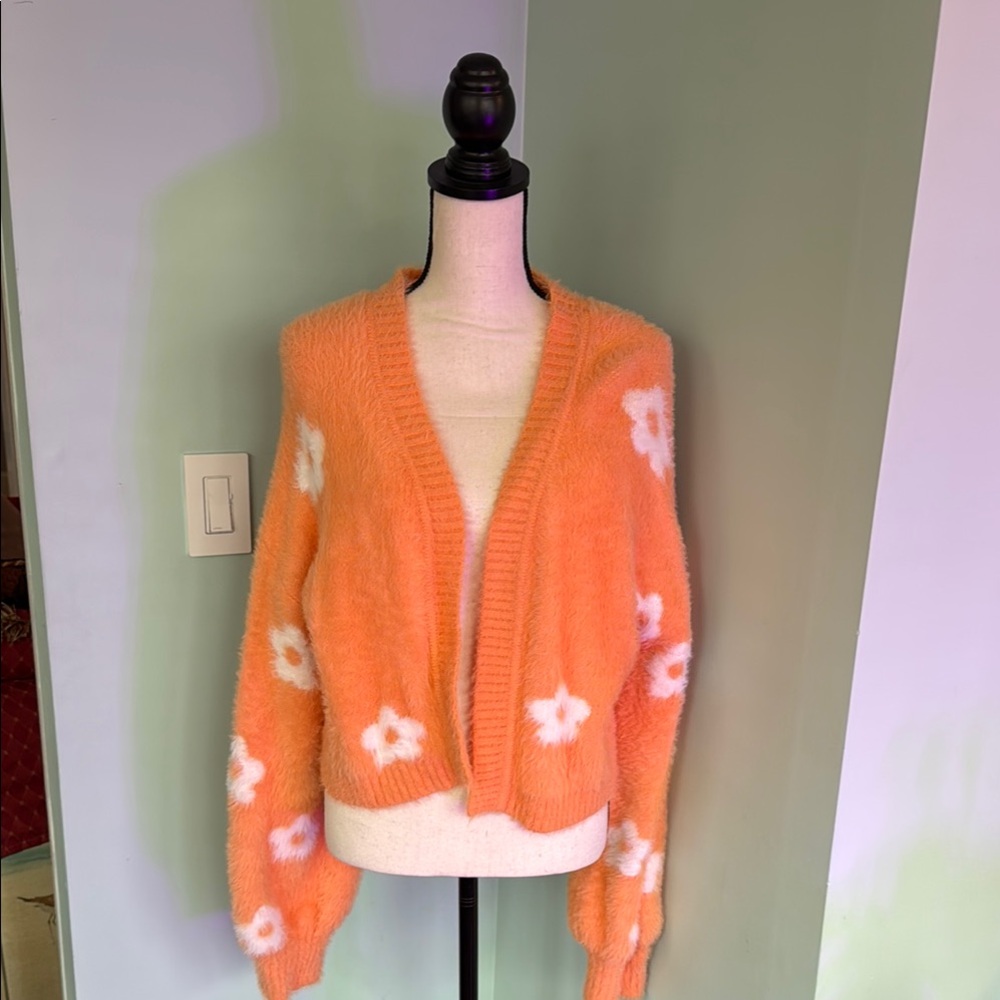 Super Cute Orange Sweater with White Flowers From Pretty Garbags. New. Size L.